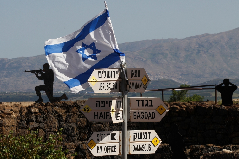 An Israeli flag is seen placed on Mount Bental in the Israeli-annexed Golan Heights on May 10, 2018.  AFP / Jalaa Marey