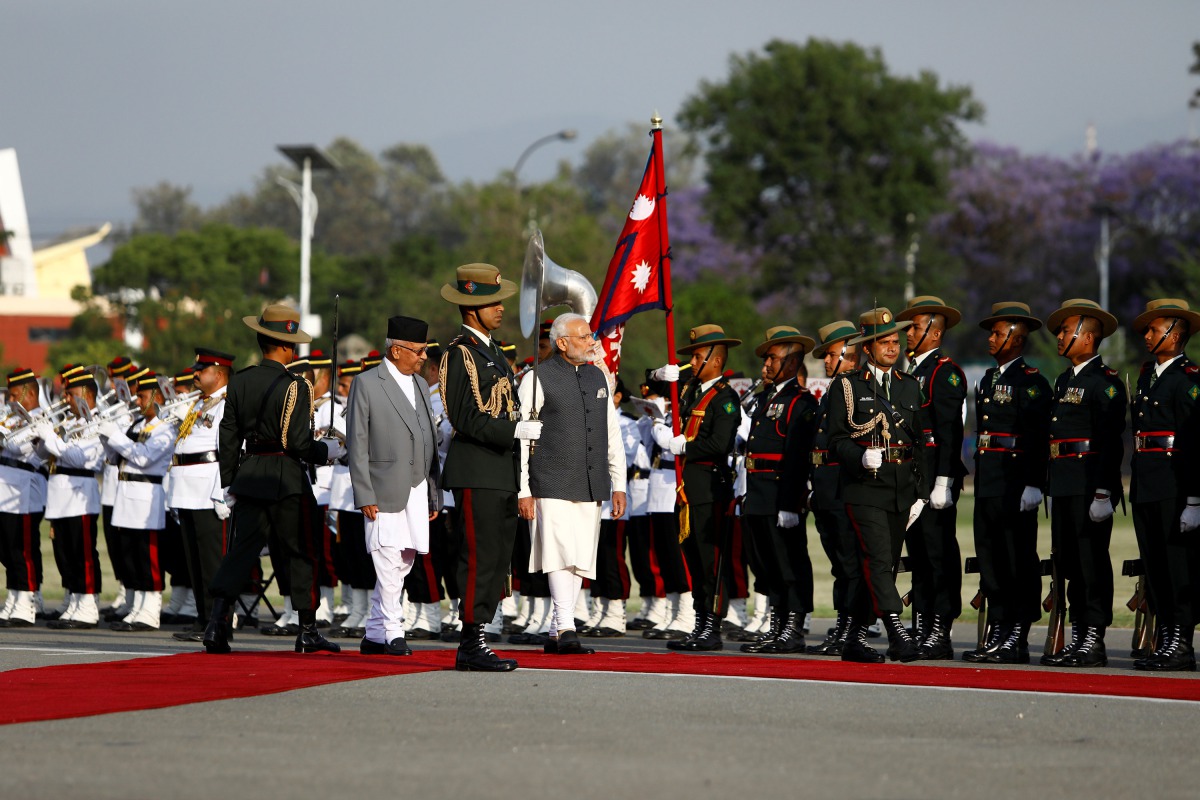India's Prime Minister Narendra Modi and his Nepalese counterpart Khadga Prasad Sharma Oli, also known as K.P. Oli, inspect a guard of honour after his arrival in Kathmandu, Nepal May 11, 2018. Reuters/Hemanta Shrestha