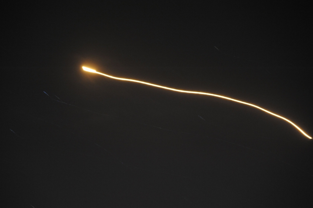 An image released by the Syrian Arab News Agency (SANA) early on May 10, 2018 purportedly shows what the official news agency said was air defence systems intercepting Israeli missiles over Syrian airspace, without specifying the location. AFP PHOTO / SAN
