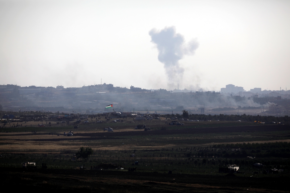 Smoke rises following an explosion in the northern Gaza Strip, as seen from the Israeli side of the border between Israel and Gaza, May 14, 2018. REUTERS/Amir Cohen