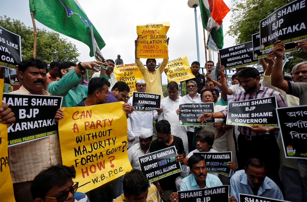 Supporters of India's main opposition Congress party protest against India's ruling Bharatiya Janata Party (BJP) leader B.S. Yeddyurappa's swearing-in as Chief Minister of the southern state of Karnataka, in Kolkata, India, May 18, 2018. REUTERS/Rupak De 