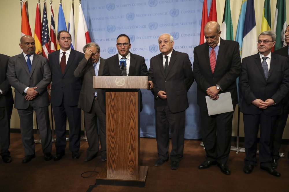 Ambassador of Kuwait to the United Nations Mansour Al-Otaibi (C). Drew Angerer/AFP
