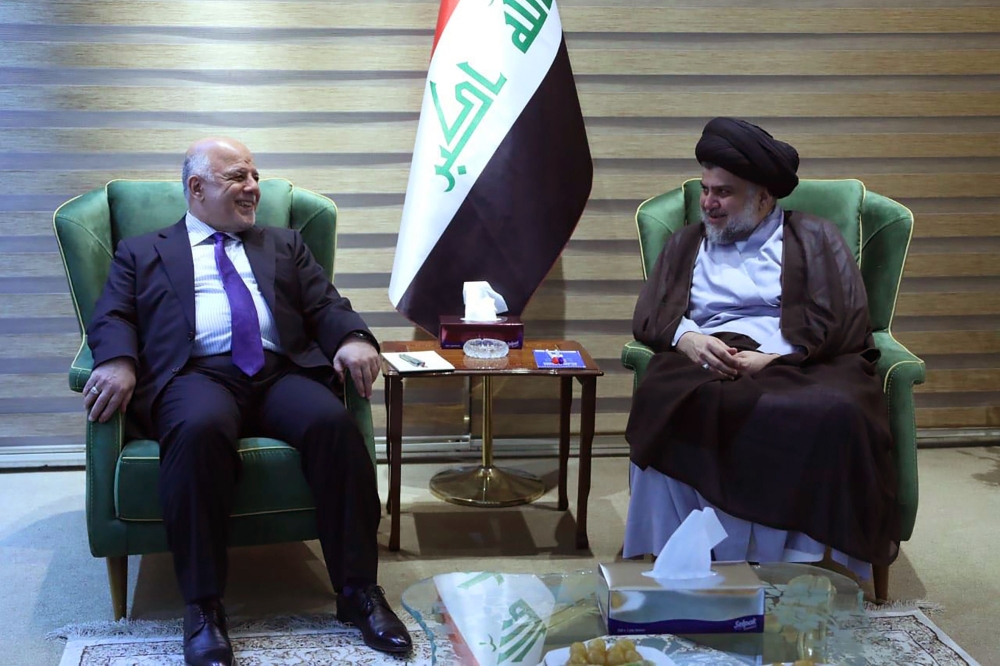 Iraqi Prime Minister Haider al-Abadi meeting with Iraqi Shiite cleric and leader Moqtada al-Sadr in Baghdad. AFP / IRAQI PRIME MINISTER'S PRESS OFFICE
