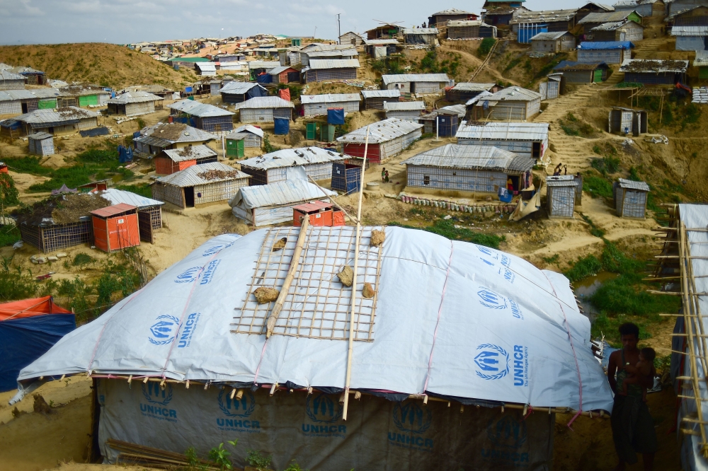Sand bags are seen on the roof of a shelter to weigh it down in preparation for the upcoming monsoon season in Kutupalong refugee camp in Ukhia.AFP / Munir UZ ZAMAN 
