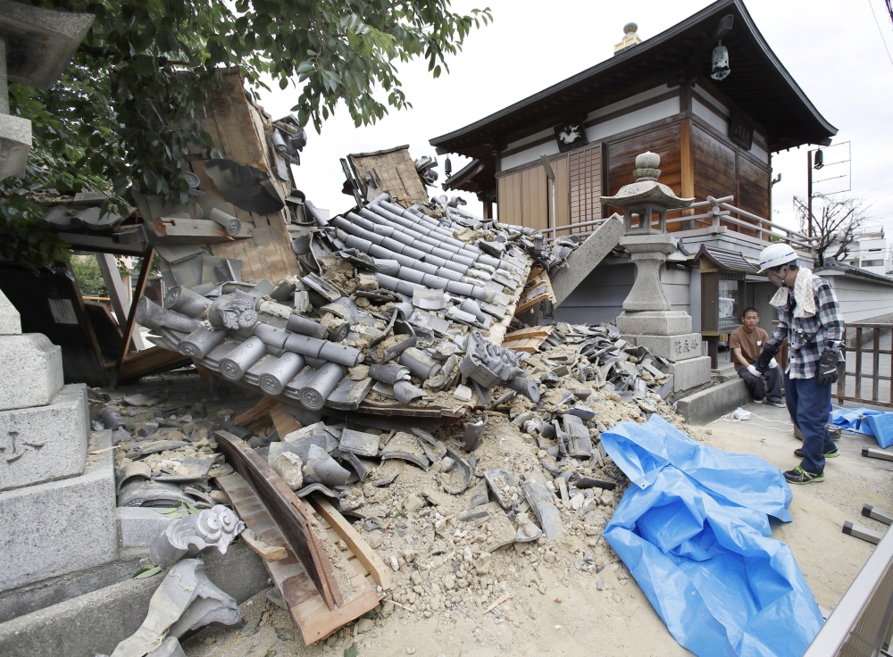 Damaged Myotoku-ji temple caused by an earthquake is seen in Ibaraki, Osaka prefecture, western Japan, in this photo taken by Kyodo June 18, 2018. Kyodo/via REUTERS
