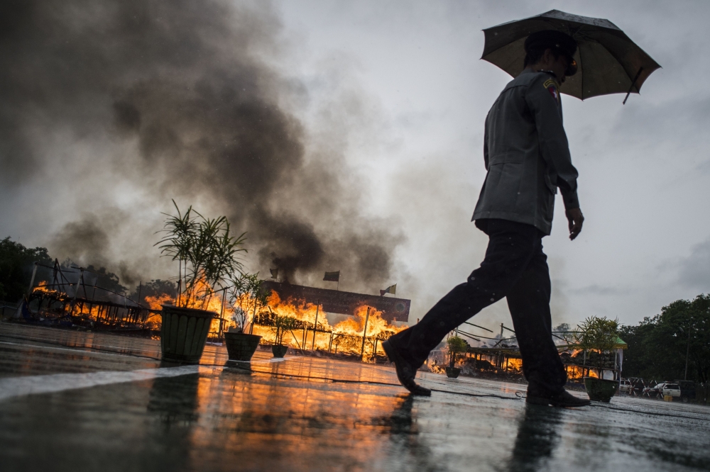 Myanmar law enforcement authorities burn seized illegal drugs worth 187 million USD, marking the International Day against Drug Abuse and Illicit Trafficking during a ceremony in Yangon on June 26, 2018. AFP / Ye Aung THU