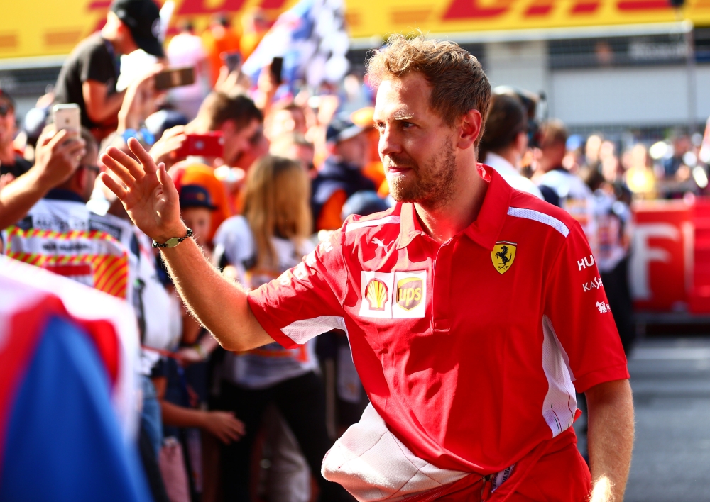 Ferrari's Sebastian Vettel celebrates after finishing in third place REUTERS/Lisi Niesner
