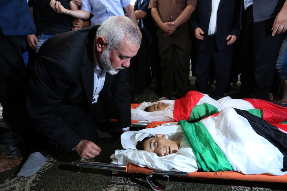Hamas Political Bureau Head Ismail Haniyeh attends a funeral ceremony of Palestinian children Amir al-Nimra (15) and Louay Kahil (16) who lost their lives after Israeli army carried out airstrikes in Gaza City, Gaza on July 15, 2018. (Ashraf Amra/Anadolu 