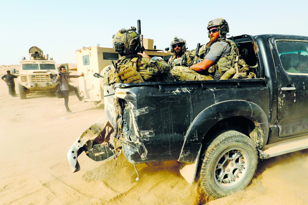 US-backed forces are pictured near the village of Susah in the eastern province of Deir Ezzor, near the Syrian border with Iraq on September 13, 2018. AFP / Delil souleiman
