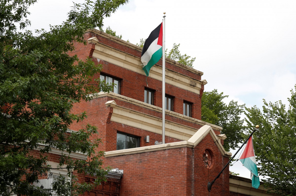 Flags fly over the Palestine Liberation Organization (PLO) office two days after President Donald Trump's national security adviser John Bolton announced that the State Department would close the PLO office in Washington, September 12, 2018. Reuters/Kevin