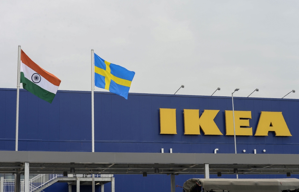In this file photo taken on August 9, 2018 the Indian national flag and Swedish flag are pictured at the new IKEA store in Hyderabad. / AFP / NOAH SEELAM 