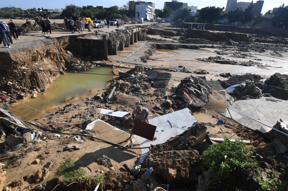 A picture taken on September 23, 2018, in the Tunisian coastal town of Nabeul shows the collapsed Bir Challouf bridge following deadly flash flooding. / AFP / FETHI BELAID 