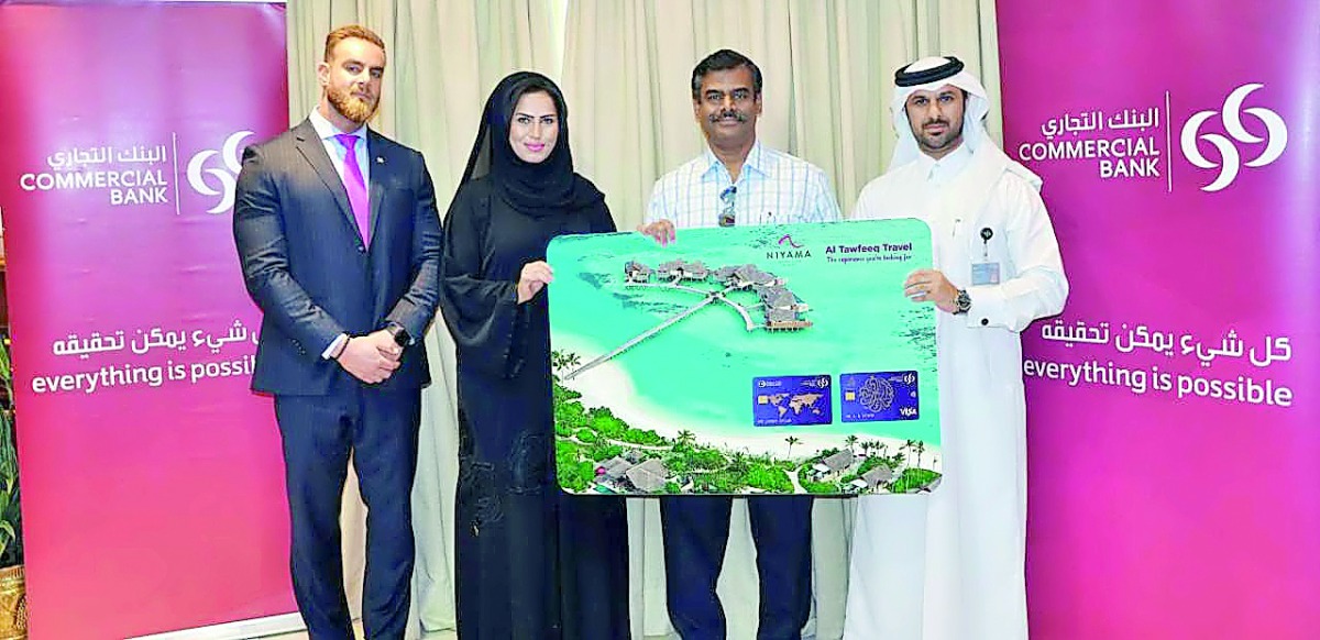 Commercial Bank officials with the bank’s International Spend Campaign winner.