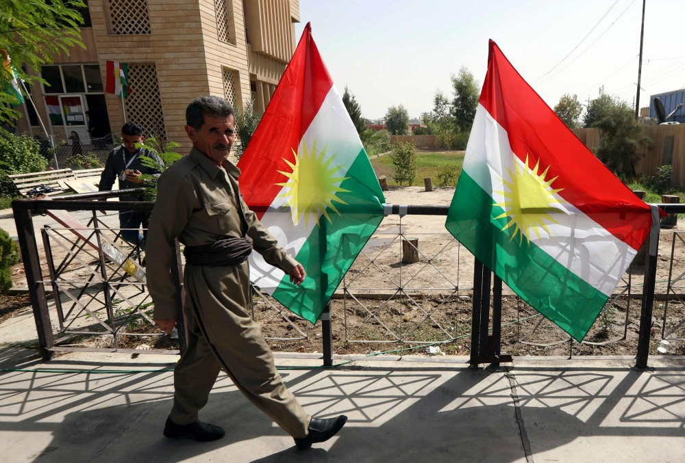 An Iraqi Kurdish man leaves after casting his ballot for the parliamentary election at a polling station in Arbil, the capital of the Kurdish autonomous region in northern Iraq, on September 30, 2018. AFP / Safin Hamed 