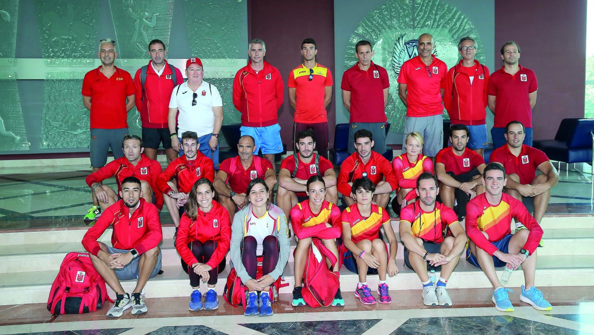 Spanish athletics team members pose for a picture during their training at Aspire Zone yesterday.