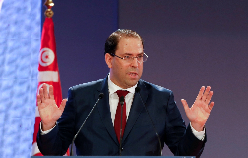 Tunisia's Prime Minister Youssef Chahed gestures as he speaks during a national conference over 2019 budget in Tunis, Tunisia, September 14, 2018. REUTERS/Zoubeir Souissi/File Photo