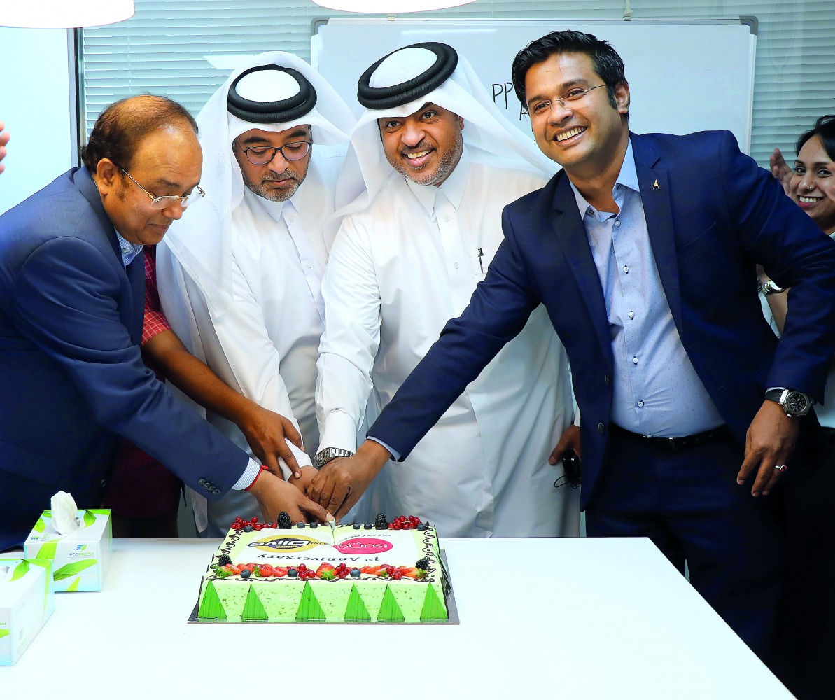 Dignitaries and officials cutting the cake to celebrate first anniversary of Radio Olivesuno network.