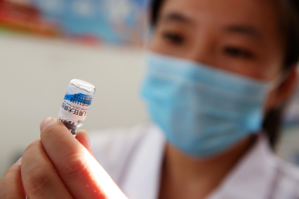 (FILES) This file picture taken on July 24, 2018 shows a nurse preparing a vaccination shot against rabies at the Disease Control and Prevention Center in Huaibei in China's eastern Anhui province. China OUT / AFP / STR