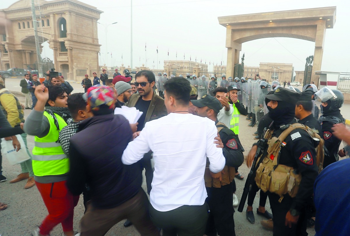 People wearing yellow vests stage a protest against lack of public service and unemployment in Basra, Iraq on December 5, 2018. (Haider el-Esadi/Anadolu Agency)