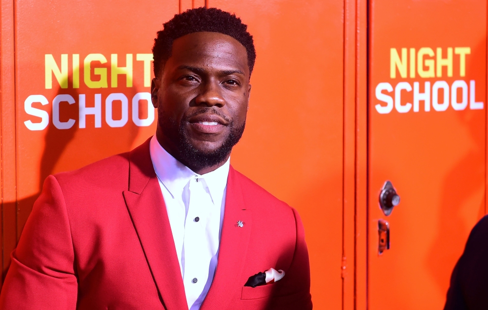 In this file photo taken on September 24, 2018 actor Kevin Hart arrives for the premiere of 'Night School' in Los Angeles, California.  / AFP / Frederic J. BROWN 