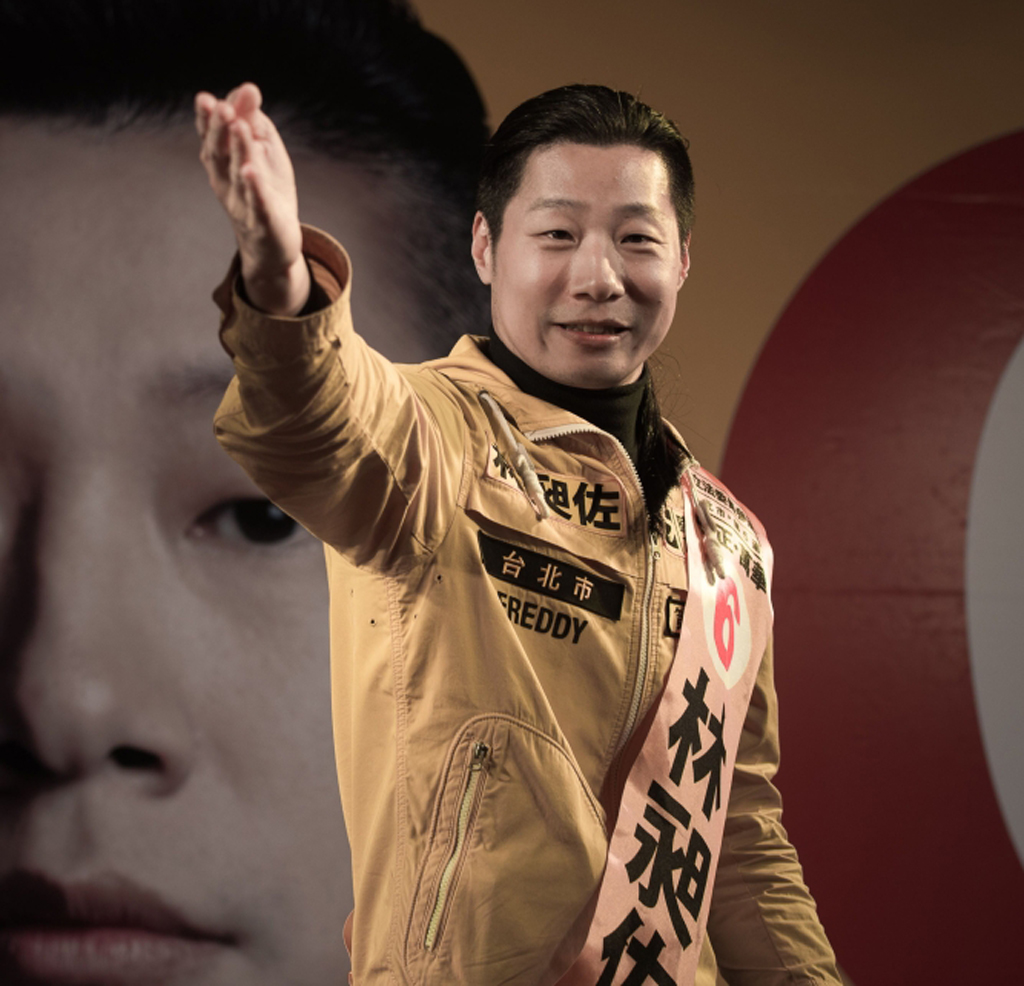 This file photo taken on January 14, 2016 shows Freddy Lim, a candidate from the New Power Party and singer of ChthoniC - one of Asia's biggest death metal bands - attending an election rally in Taipei.  / AFP / PHILIPPE LOPEZ