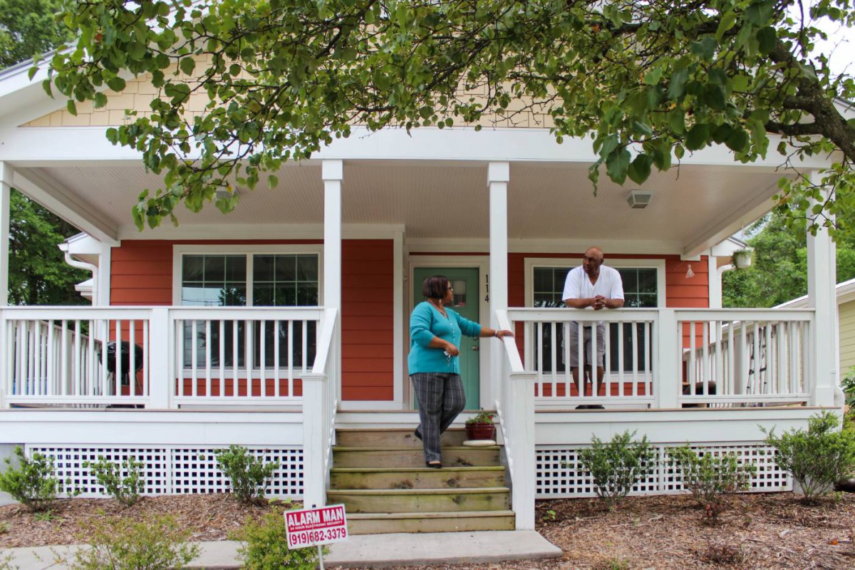 Selina Mack, director of the Durham Community Land Trust in North Carolina, USA, visits a resident living in one of the trust's properties on 17 May 2018. Thomson Reuters Foundation/Gregory Scruggs