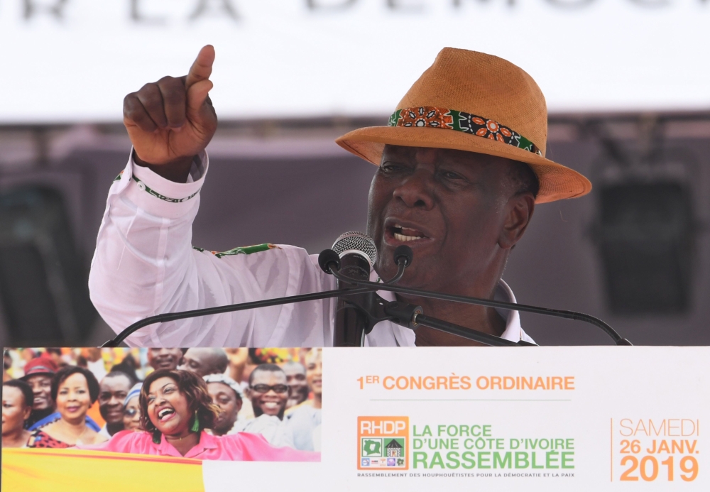 Ivory Coast president Alassane Ouattara delivers a speech at the Felix Houphoet-Boigny stadium in Abidjan during the first Congress of the political alliance 