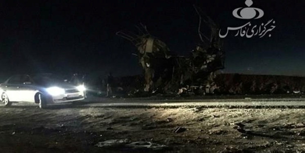 A car is seen at the site of the suicide attack on a Revolutionary Guards on the road between the cities of Zahedan and Khash, Iran, February 13, 2019. Fars News/Handout via Reuters 