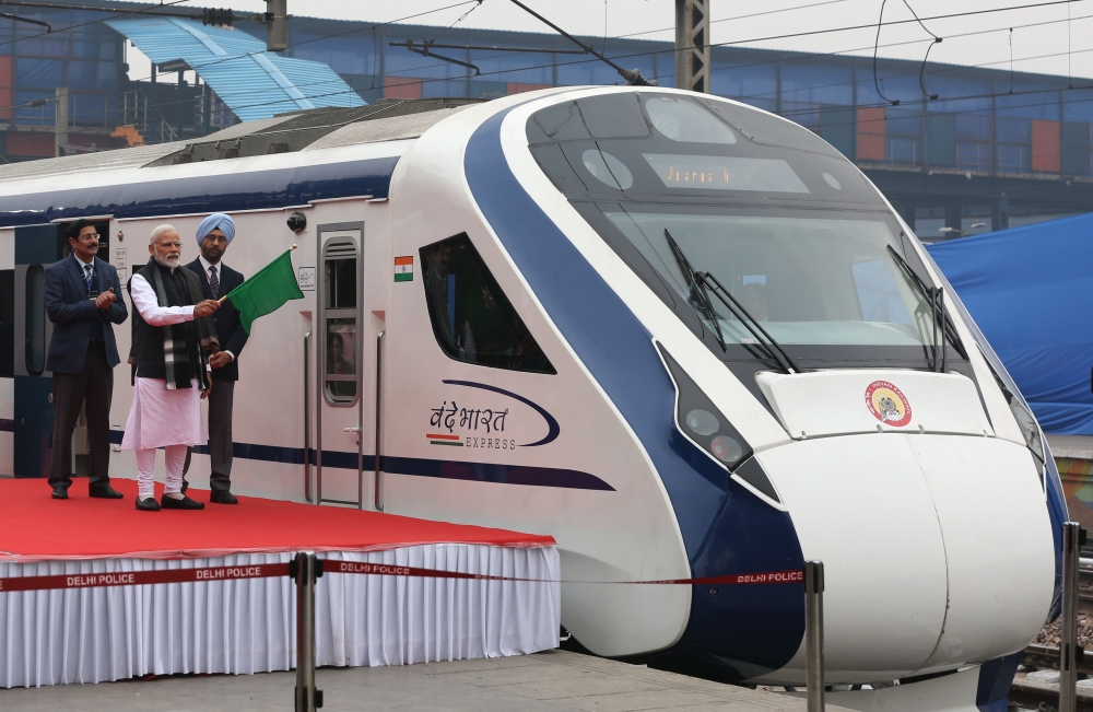 In this photo taken on February 15, 2019, Indian Prime Minister Narendra Modi (2nd L) flags off India's first semi-high speed express train Vande Bharat Express at New Delhi Railway Station. AFP / STR