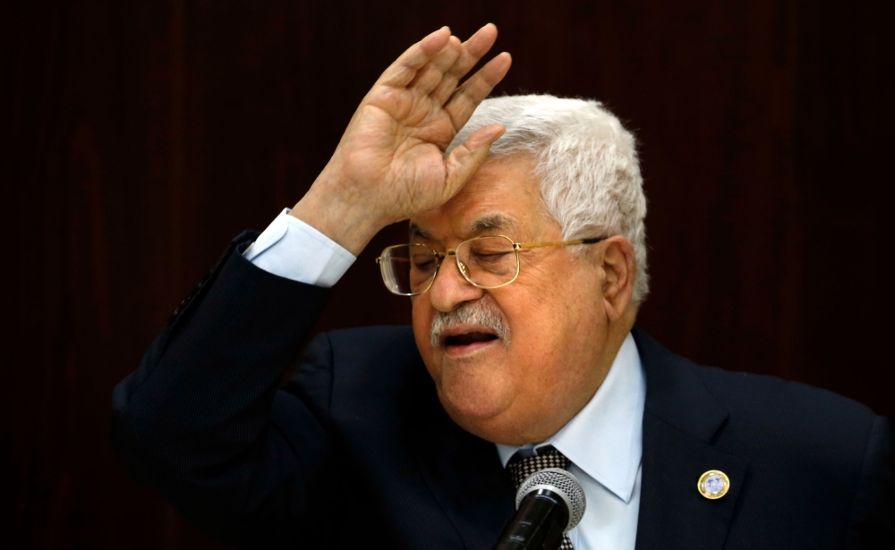 Palestinian President Mahmoud Abbas speaks during a meeting with Palestinian leaders at the Muqata, the Palestinian Authority headquarters, in the West Bank city of Ramallah, on February 20, 2019. AFP / Abbas Momani 
 