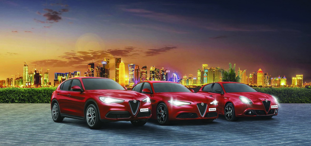 Alfa Romeo model cars seen showcased at an event.