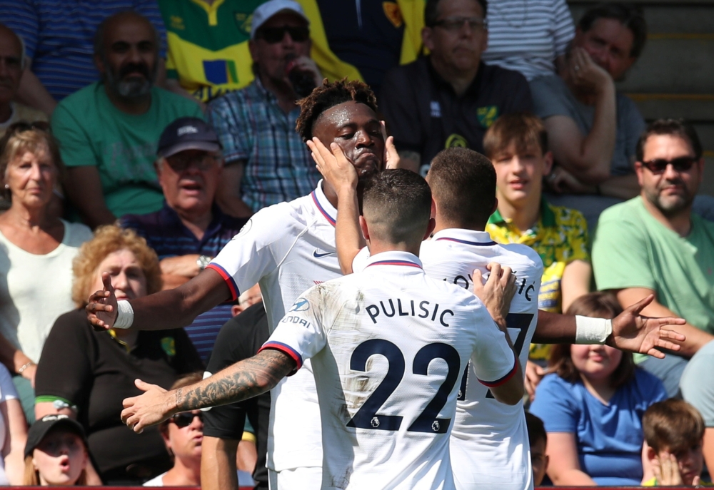 Chelsea's Tammy Abraham celebrates scoring their third goal with team mates REUTERS/Chris Radburn 