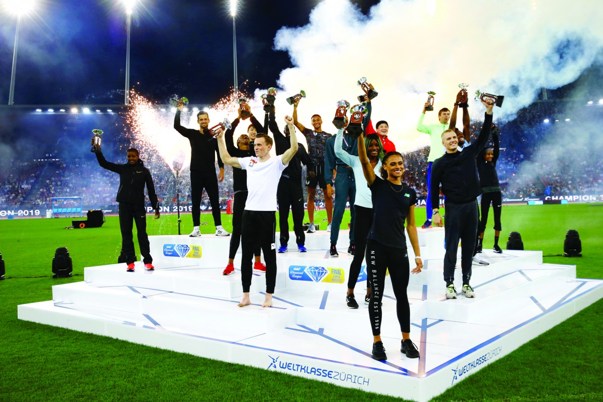 Winning athletes pose with their trophies Reuters/Arnd Wiegmann