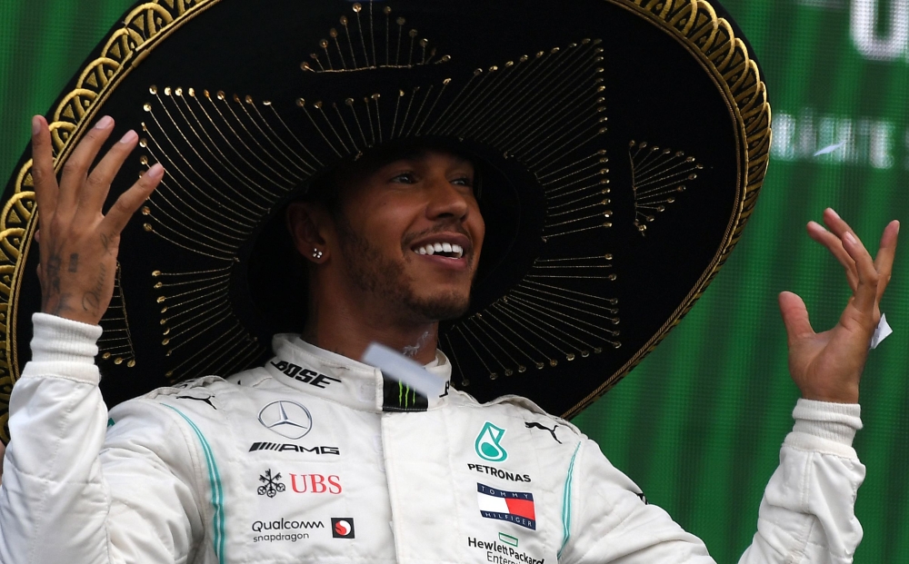 Mercedes' British driver Lewis Hamilton celebrates at the podium after winning the F1 Mexico Grand Prix, at the Hermanos Rodriguez racetrack in Mexico City on October 27, 2019.  AFP / PEDRO PARDO
