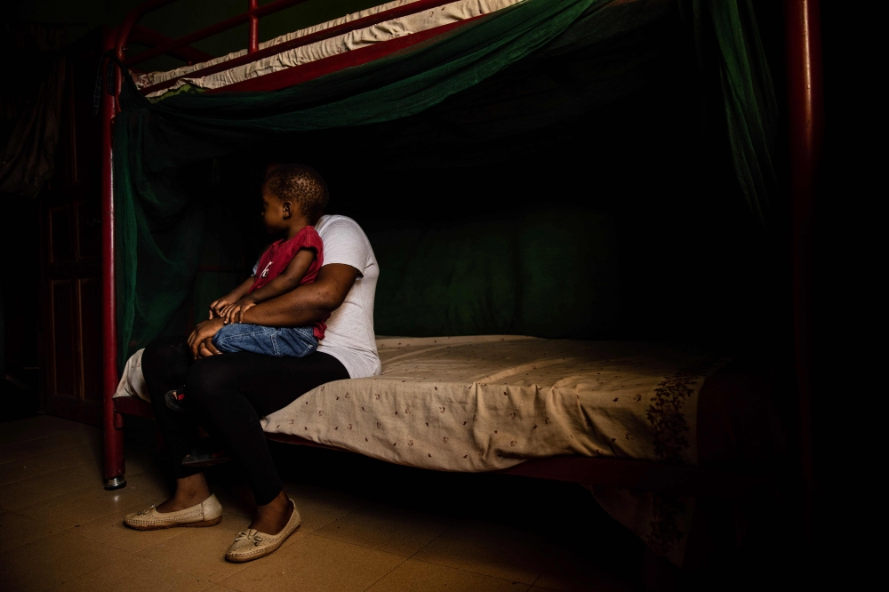 Representative image: A woman and her child rest on June 26, 2019 in Benin City, at one of the shelters of the Society For the Empowerment Of Young Persons. AFP / Fati Abubakar