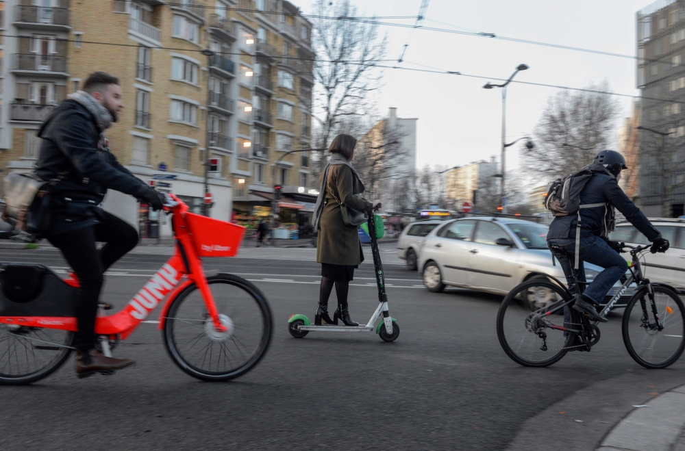 Commuters cross an intersection at Porte de Vanves in Paris on December 18, 2019, during an ongoing transport strike in France. (AFP / AURORE MESENGE)
