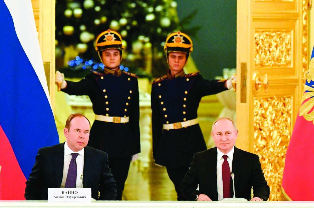 Russian President Vladimir Putin (R) and Chief of Staff of the Presidential Executive Office Anton Vaino attend a meeting with business community at the Kremlin in Moscow on December 25, 2019. AFP / Alexander Nemenov