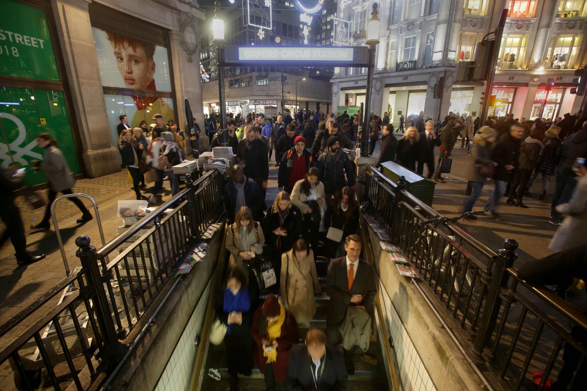 Commuters descend the stairs to catch the tube at Oxford Circus Station in central London on November 24, 2017, following an incident. AFP / Daniel Leal-Olivas