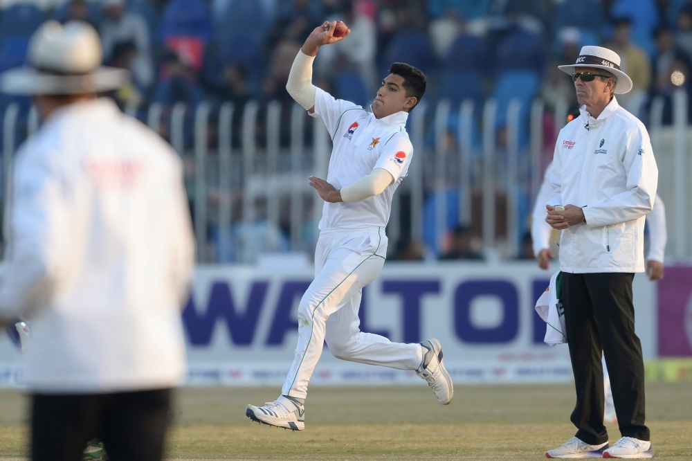 Pakistan's Naseem Shah (C) delivers the ball during the third day of the first cricket Test match between Pakistan and Bangladesh at the Rawalpindi Cricket Stadium in Rawalpindi on February 9, 2020. (AFP / AAMIR QURESHI)
