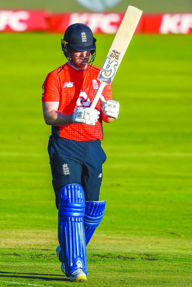 England's captain Eoin Morgan celebrats after getting his fifty run during the third T20 International cricket match between South Africa and England at the SuperSport Stadium in Pretoria, South Africa on February 16, 2020. AFP / Christiaan Kotze
