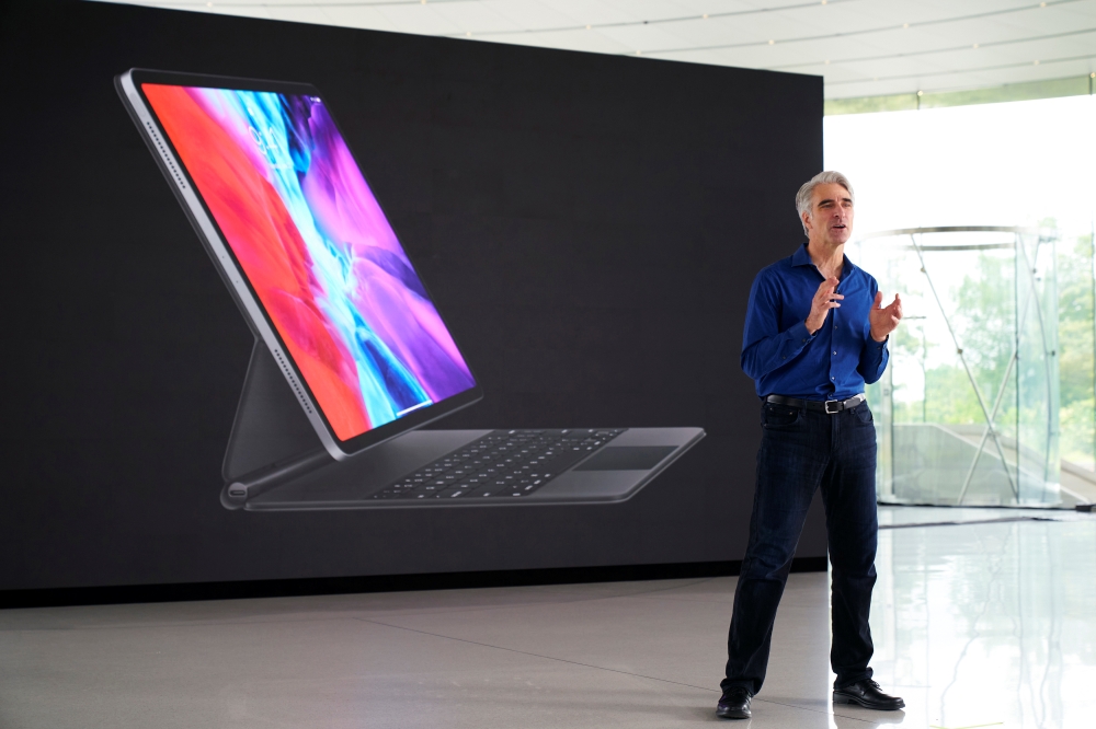 Craig Federighi, Apple's senior vice president of software engineering, speaks during the keynote address at the 2020 Apple Worldwide Developers Conference (WWDC) at Apple Park in Cupertino, California, U.S., June 22, 2020. Brooks Kraft/Apple Inc/Handout 