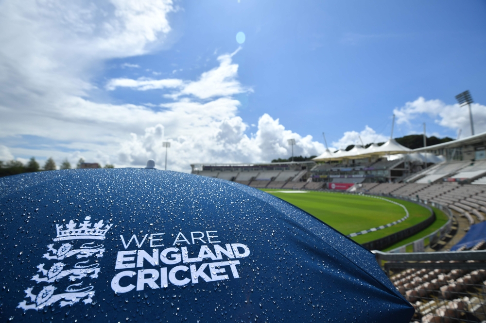 Raindrops cover an England umbrella in the empty stands as a patch of blue sky appears as the start of play is delayed on the fifth day of the second Test cricket match between England and Pakistan at the Ageas Bowl in Southampton, southwest England on Au