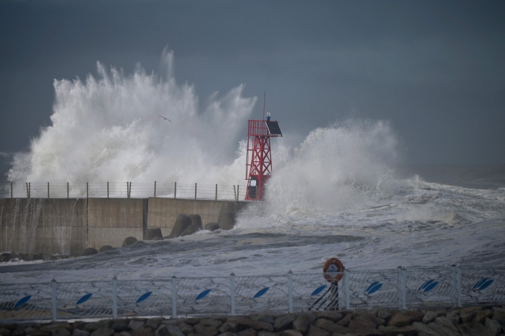 Waves brought by Typhoon Haishen crash into the breakwater in the eastern port city of Sokcho on September 7, 2020. The powerful typhoon lashed South Korea on September 7 after smashing into southern Japan with record winds and heavy rains that left four 