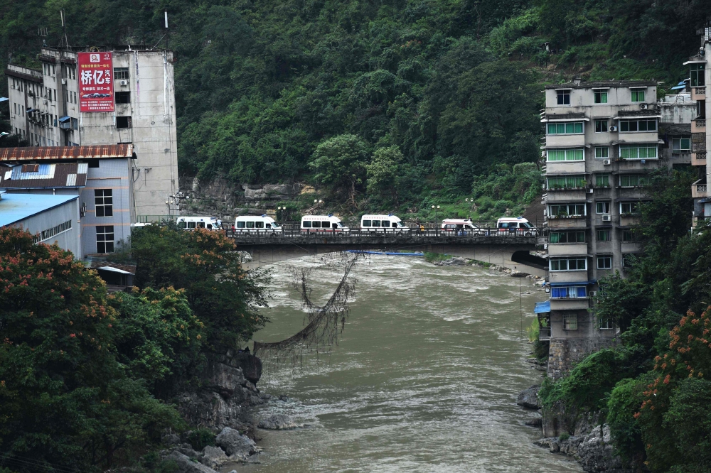Ambulances wait outside the Songzao Coal Mine near Chongqing, in southwest China on September 27, 2020. Sixteen workers died and one is in a critical condition after being trapped underground in a coal mine in southwest China on September 27, reported sta