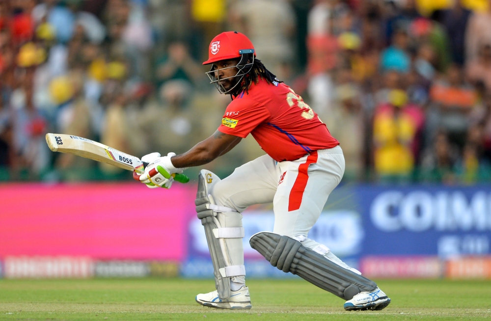 In this file photo taken on May 05, 2019 Kings XI Punjab cricketer Chris Gayle plays a shot during the 2019 Indian Premier League (IPL) Twenty20 cricket match between Kings XI Punjab and Chennai Super Kings at the Punjab Cricket Association Stadium in Moh