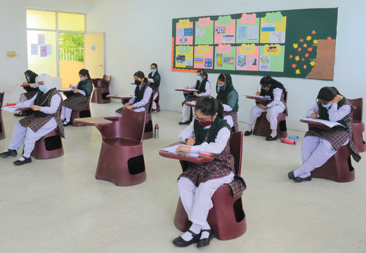 PISQ students taking exam following COVID-19 measures.