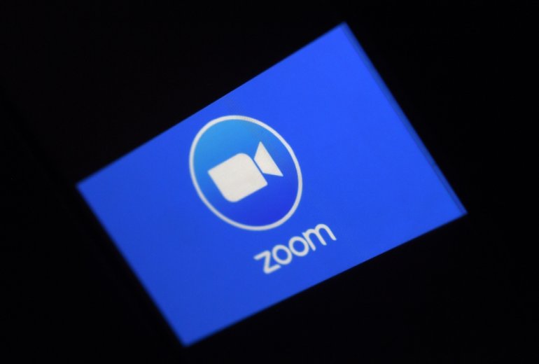 In this file photo illustration a Zoom App logo is displayed on a smartphone on March 30, 2020 in Arlington, Virginia. Zoom shares soared on August 31 after the video-meeting service reported that quarterly revenue rocketed as its ranks of users more than