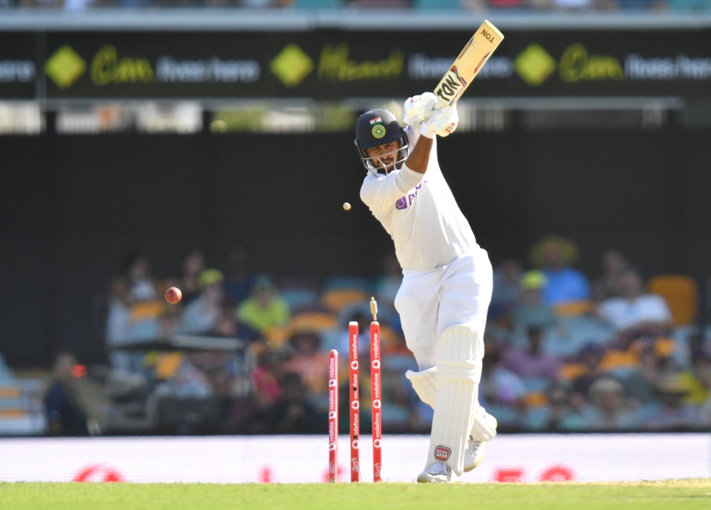 Shardul Thakur of India is clean bowled by Pat Cummins of Australia during day three of the fourth test match between Australia and India at the Gabba in Brisbane, Australia, January 17, 2021. AAP Image/Darren England via Reuters