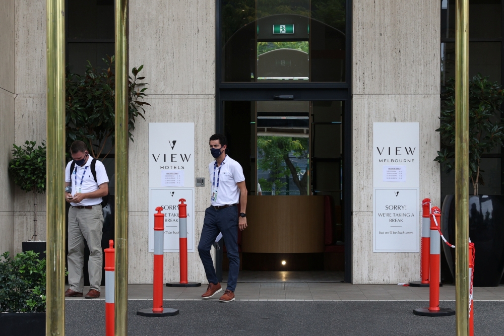 People depart a hotel where tennis players and personnel preparing for the Australian Open were tested for the coronavirus disease (COVID-19) following the news a quarantine hotel worker tested positive in Melbourne, Australia, February 4, 2021. REUTERS/L