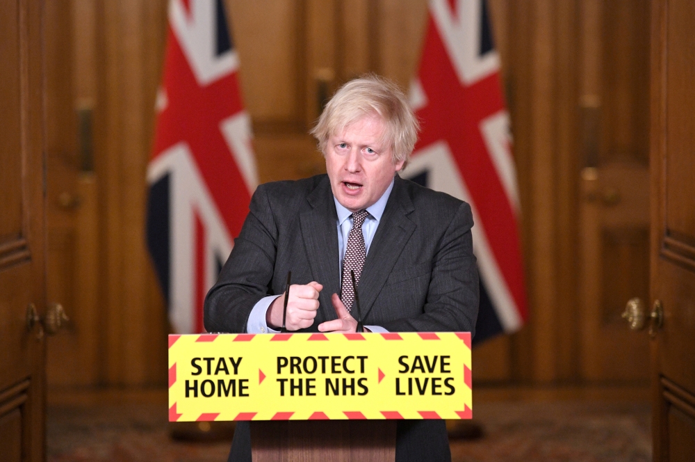Britain's Prime Minister Boris Johnson addressees the media at a coronavirus disease (COVID-19) pandemic briefing in Downing Street, London, Britain February 3, 2021. Stefan Rousseau/Pool via REUTERS/File Photo